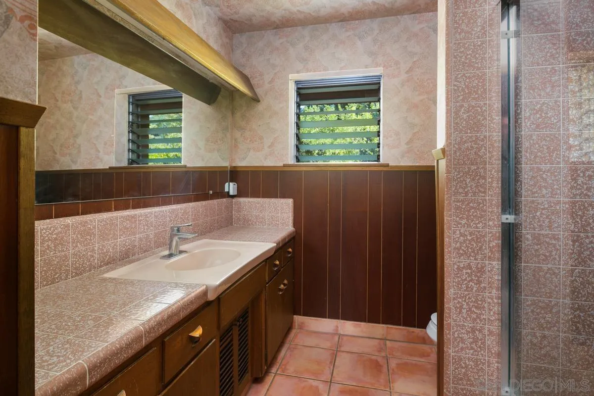 32630 Camino Moro Warner Springs, CA 92086 - Photo 24 of 33 a bathroom with a granite countertop sink and a mirror