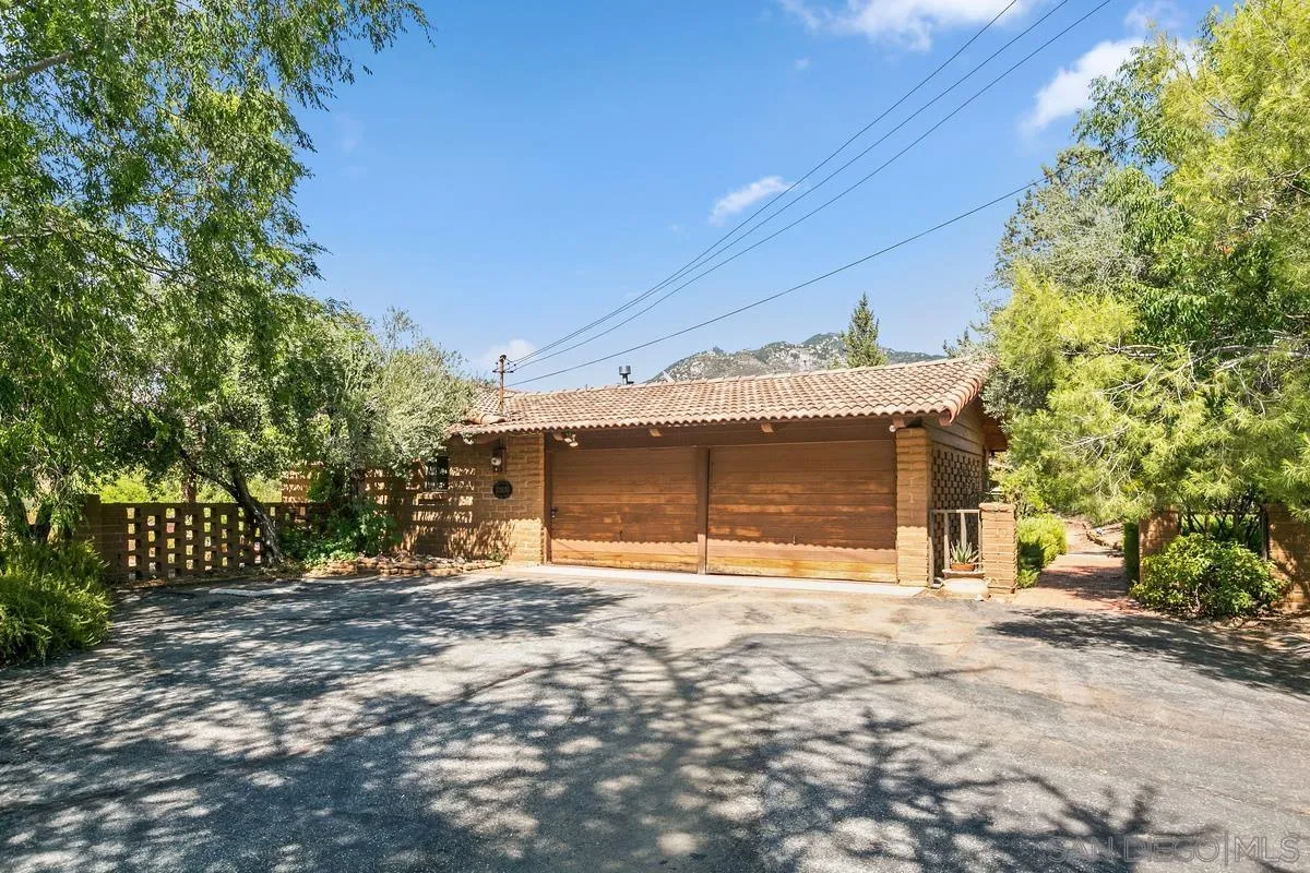 32630 Camino Moro Warner Springs, CA 92086 - Photo 3 of 33 a front view of a house with a yard and garage