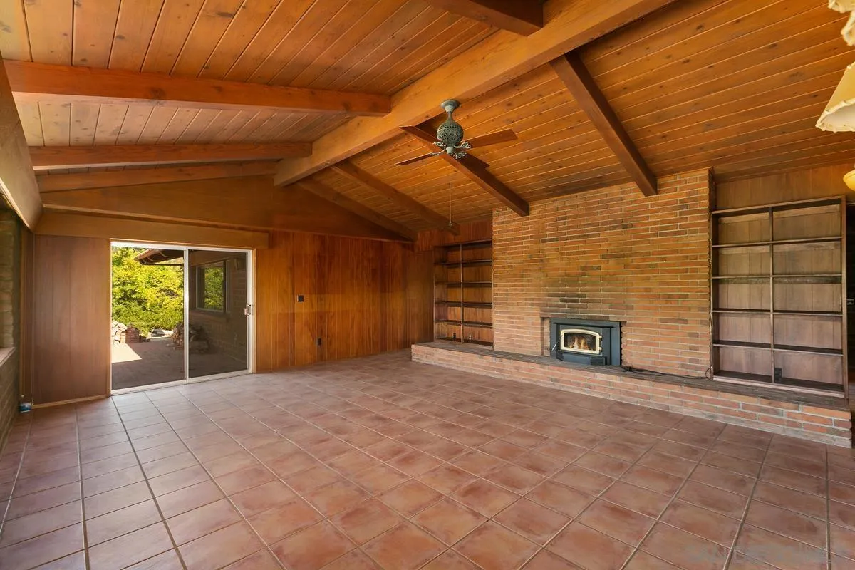 32630 Camino Moro Warner Springs, CA 92086 - Photo 10 of 33 a view of an empty room with a fireplace and a window