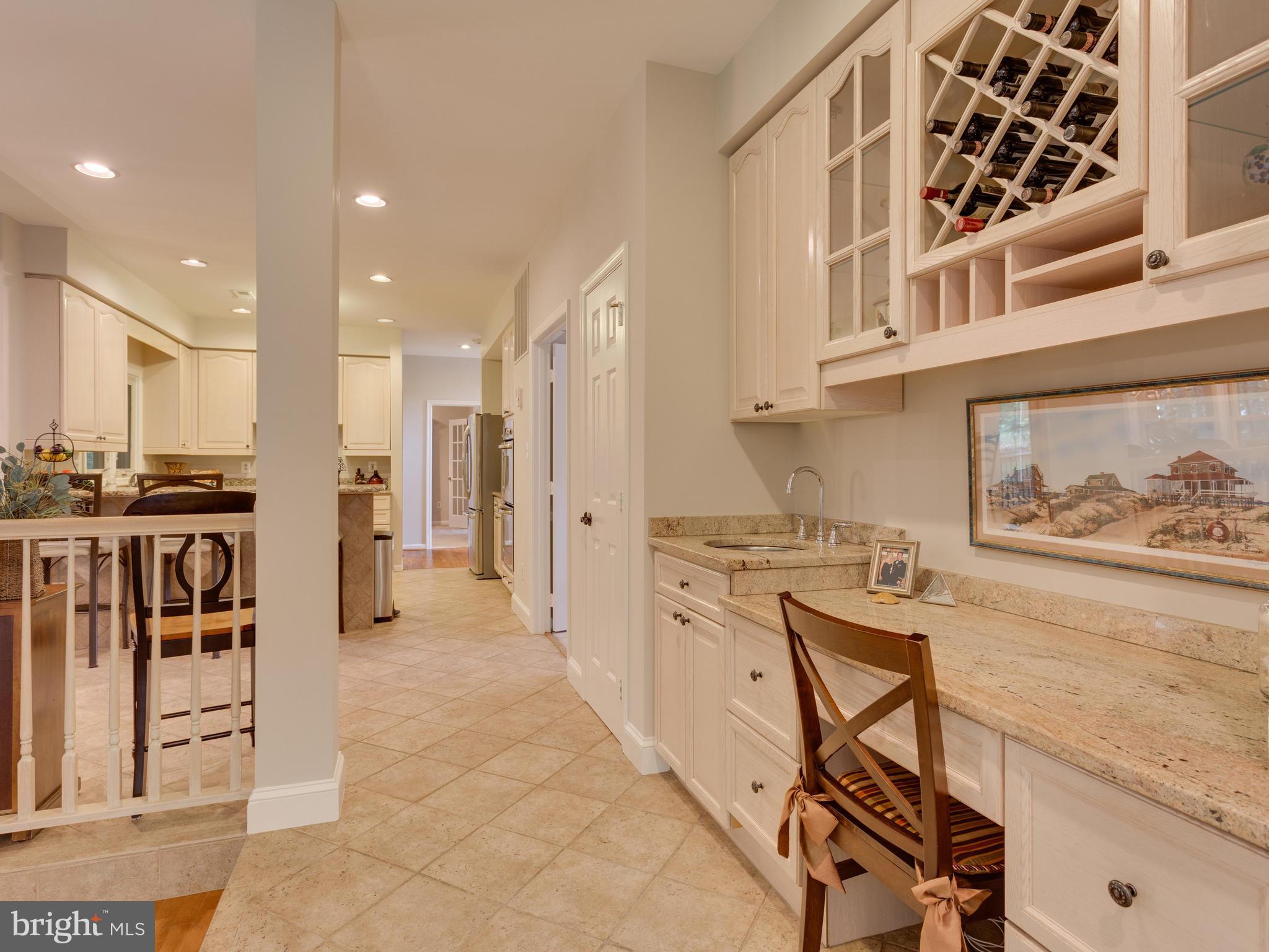8119 Ridge Creek Way Springfield, VA 22153 - Photo 10 of 30 Wet Bar and Built-in Desk off of Kitchen