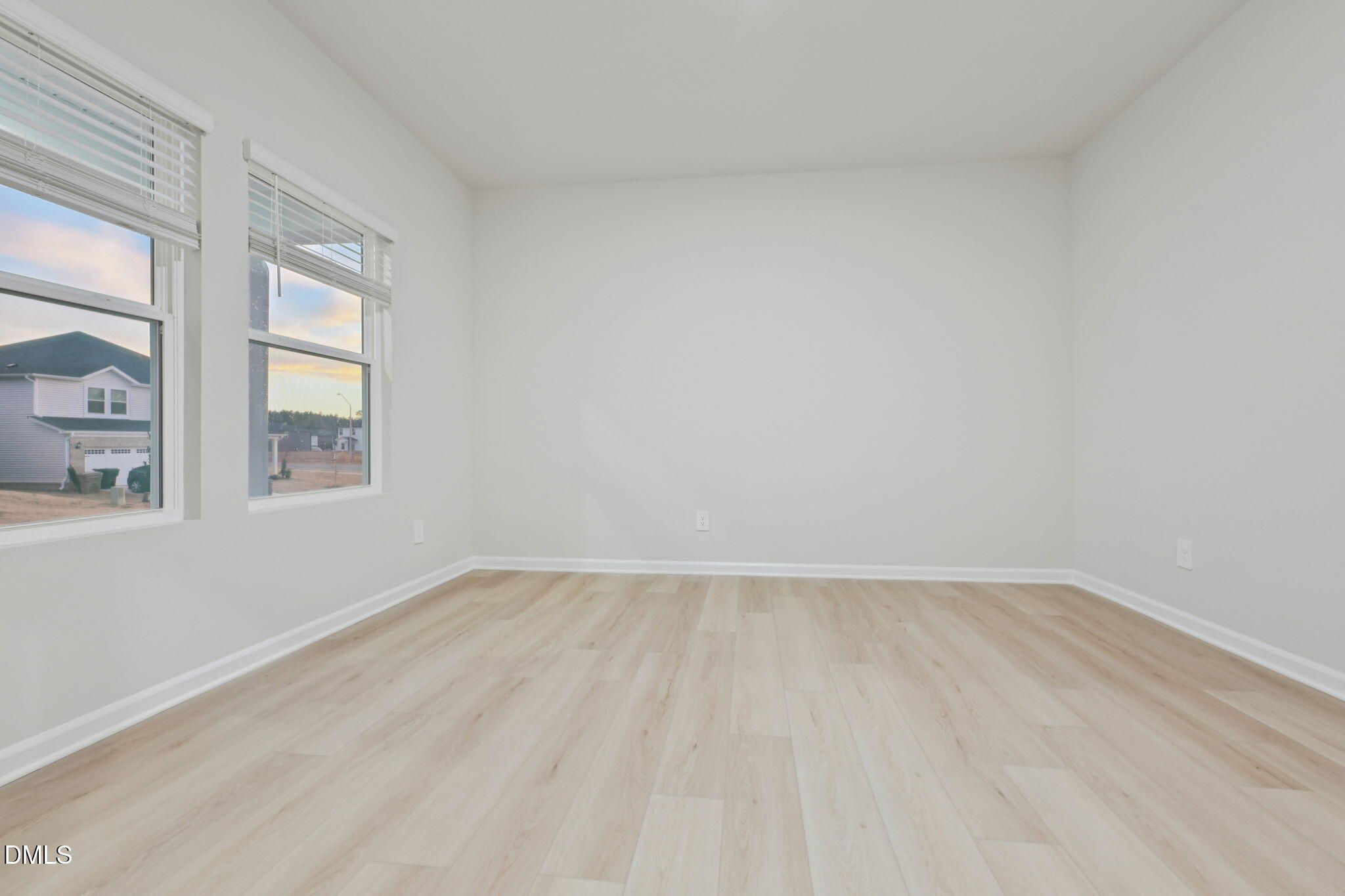 2147 Topsail Road Durham, NC 27703 - Photo 10 of 31 wooden floor in an empty room with a window