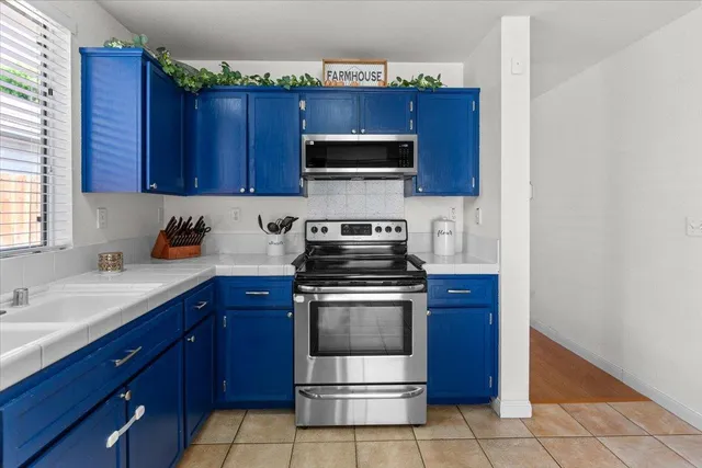 a kitchen with a stove and a microwave