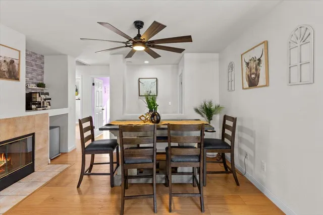 a view of a dining room with furniture and wooden floor