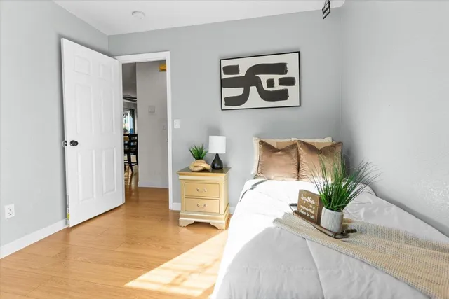 a bedroom with bed and a window