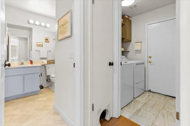 a bathroom with a sink toilet vanity and shower