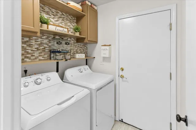 a view of a patio with a table and chairs