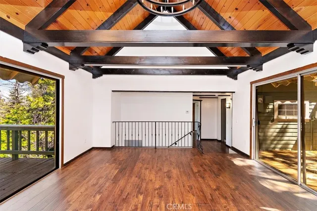 a view of an entryway with wooden floor