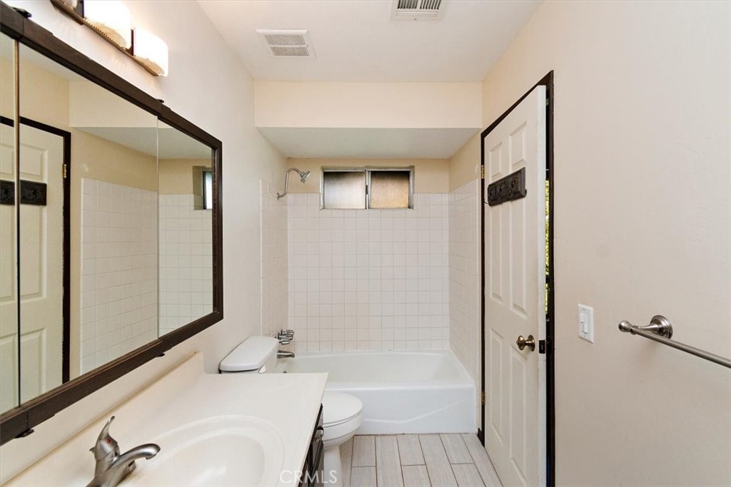 26432 Lake Forest Drive Twin Peaks, CA 92391 - Photo 23 of 27 a bathroom with a tub and shower