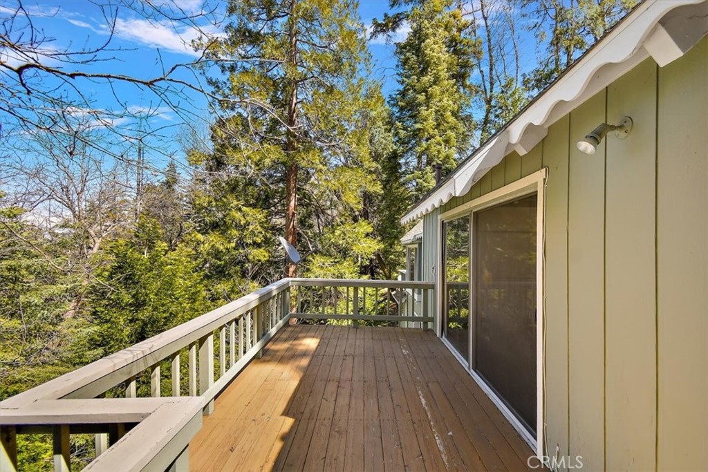 26432 Lake Forest Drive Twin Peaks, CA 92391 - Photo 7 of 27 a view of balcony with wooden floor and fence