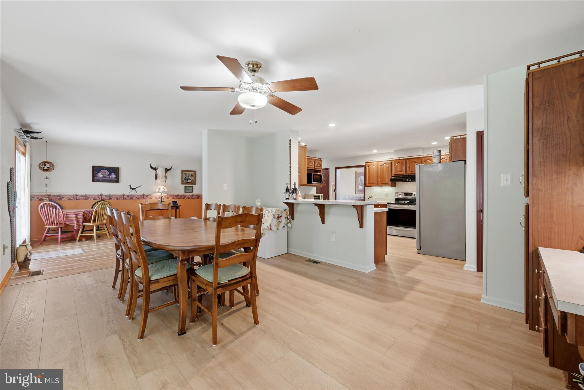 16335 Back Road Strasburg, VA 22657 - Photo 16 of 56 a living room with stainless steel appliances kitchen island granite countertop furniture and a dining table