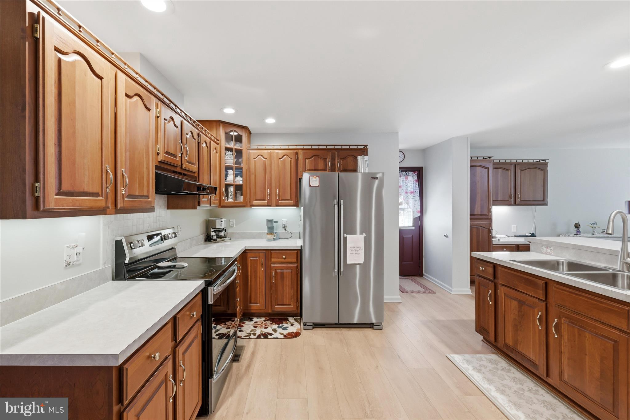 16335 Back Road Strasburg, VA 22657 - Photo 18 of 56 a kitchen with stainless steel appliances a sink a stove a refrigerator cabinets and a sink