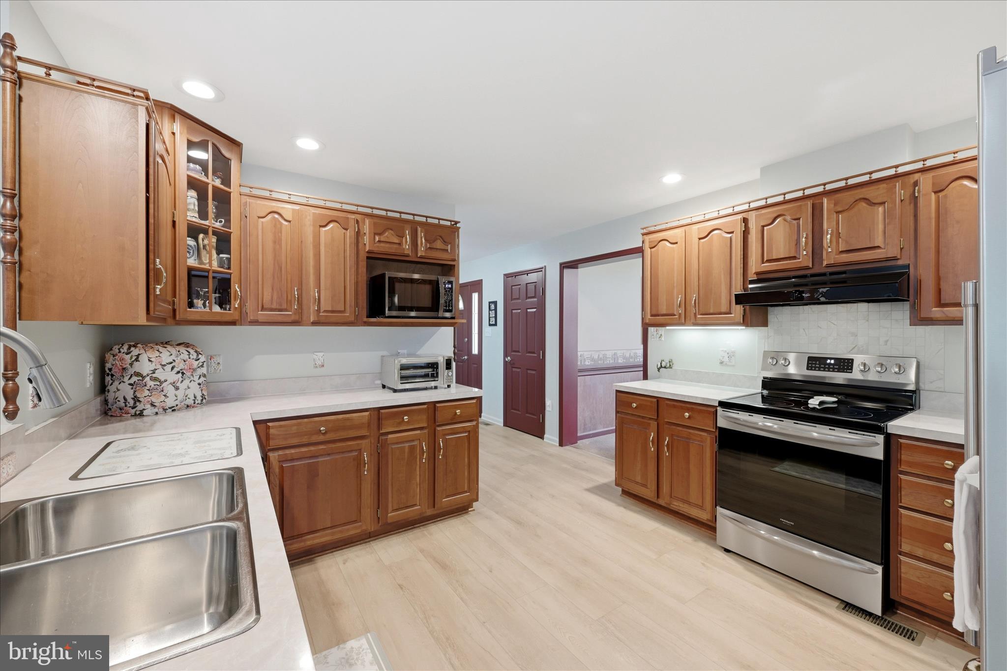 16335 Back Road Strasburg, VA 22657 - Photo 19 of 56 a kitchen with stainless steel appliances granite countertop a stove a sink and a microwave