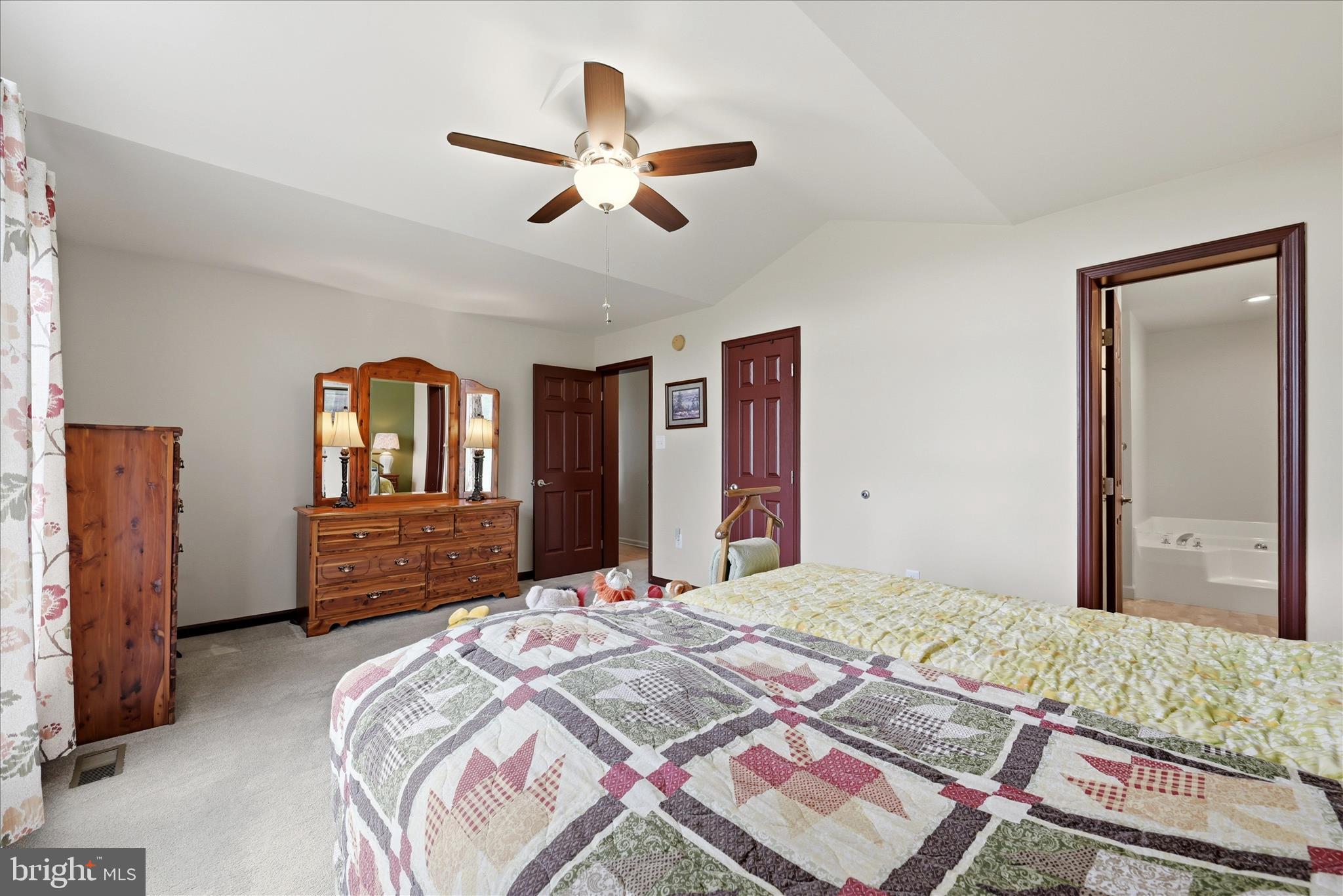 16335 Back Road Strasburg, VA 22657 - Photo 25 of 56 a bedroom with a balcony a bed and a chandelier