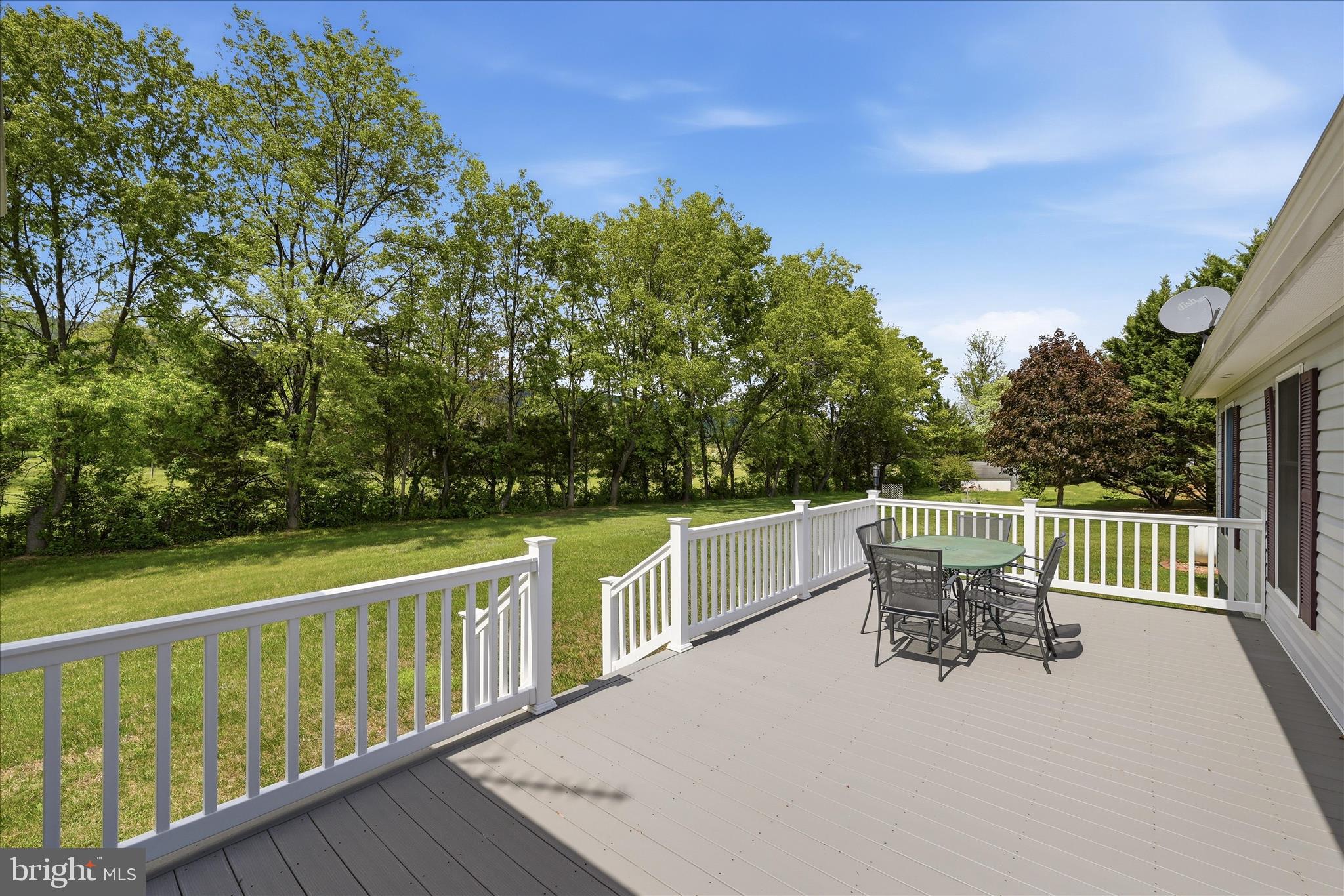 16335 Back Road Strasburg, VA 22657 - Photo 40 of 56 a roof deck with table and chairs and wooden floor