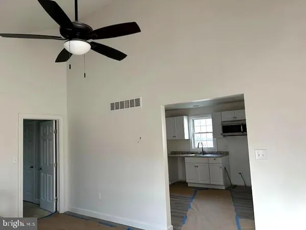 a kitchen with a refrigerator a sink dishwasher and a stove
