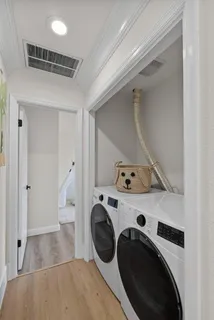 a view of storage and utility room with washer and dryer