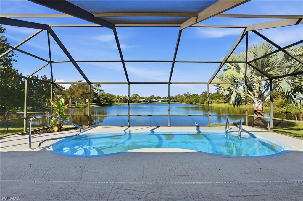 6735 Plantation Manor Loop Fort Myers, FL 33966 - Photo 1 of 46 a view of a swimming pool with a patio