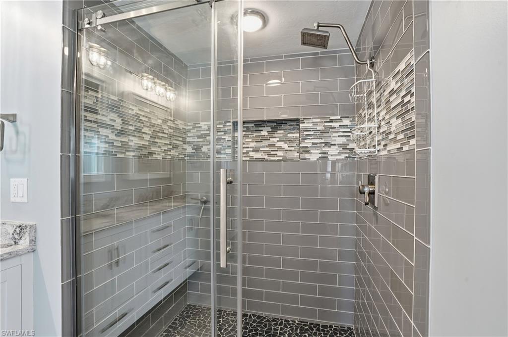 6735 Plantation Manor Loop Fort Myers, FL 33966 - Photo 18 of 46 a bathroom with a shower