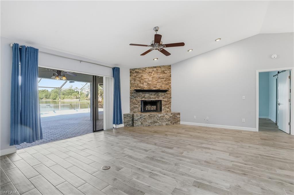 6735 Plantation Manor Loop Fort Myers, FL 33966 - Photo 20 of 46 a view of empty room with wooden floor and fan