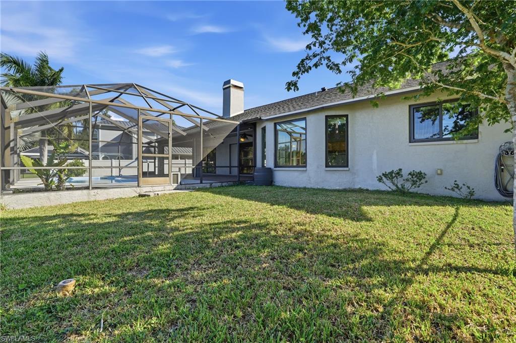 6735 Plantation Manor Loop Fort Myers, FL 33966 - Photo 38 of 46 a house view with a swimming pool