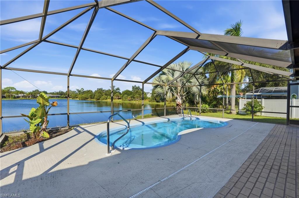 6735 Plantation Manor Loop Fort Myers, FL 33966 - Photo 9 of 46 a view of a swimming pool with a patio