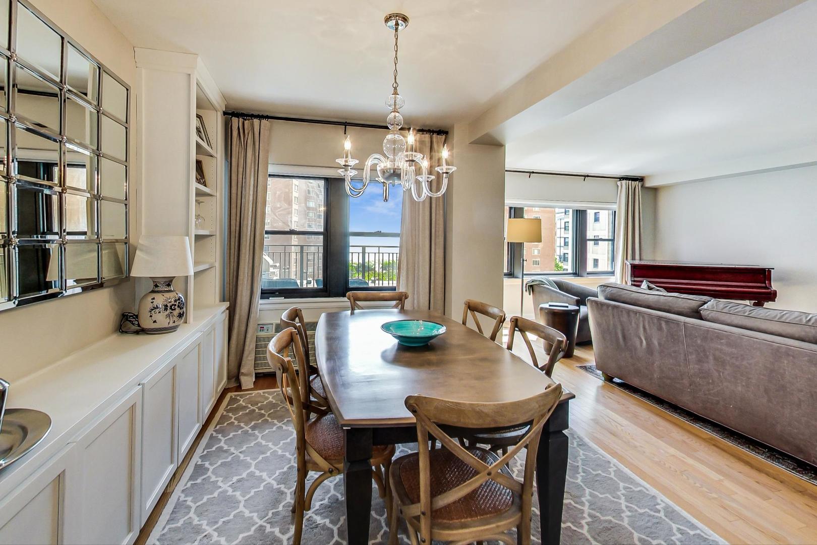 1350 North Astor Street, Unit 8B Chicago, IL 60610 - Photo 11 of 27 a view of a dining room with furniture window and wooden floor
