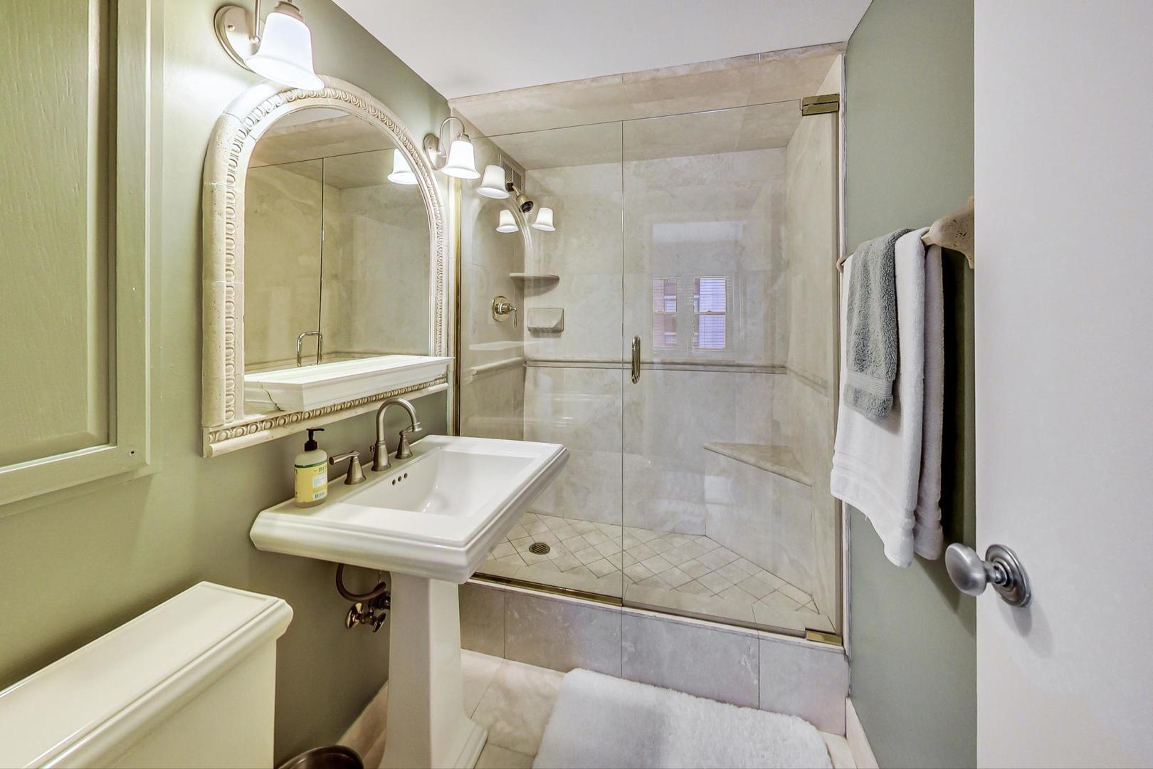 1350 North Astor Street, Unit 8B Chicago, IL 60610 - Photo 17 of 27 a bathroom with a sink and mirror