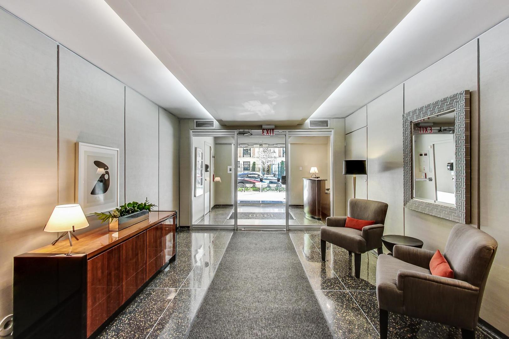 1350 North Astor Street, Unit 8B Chicago, IL 60610 - Photo 3 of 27 a lobby with furniture wooden floor and window