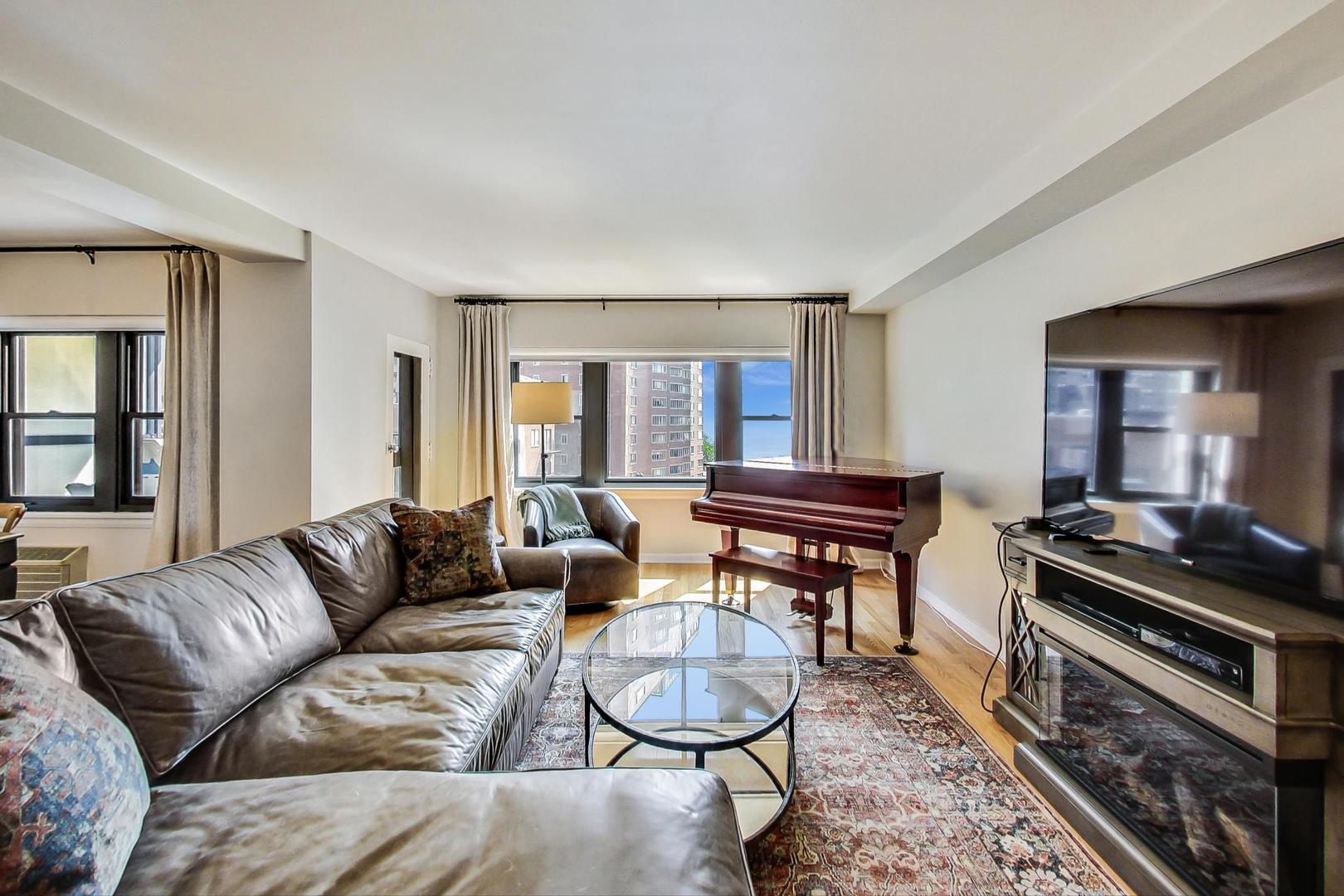 1350 North Astor Street, Unit 8B Chicago, IL 60610 - Photo 5 of 27 a living room with furniture and a window