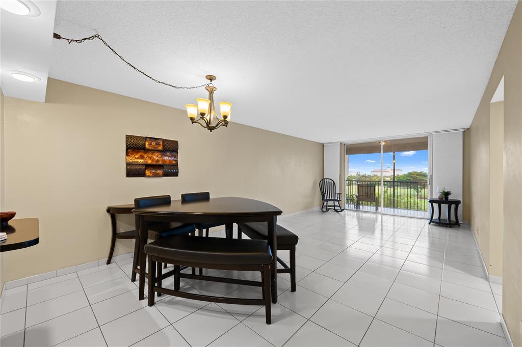 3300 West Rolling Hills Circle, Unit 610 Davie, FL 33328 - Photo 2 of 22 a view of a dining room with furniture
