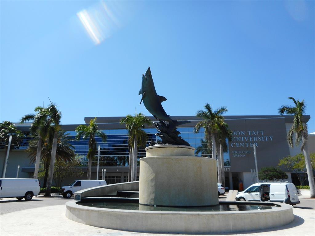 3300 West Rolling Hills Circle, Unit 610 Davie, FL 33328 - Photo 22 of 22 a view of a building with a fountain in the background