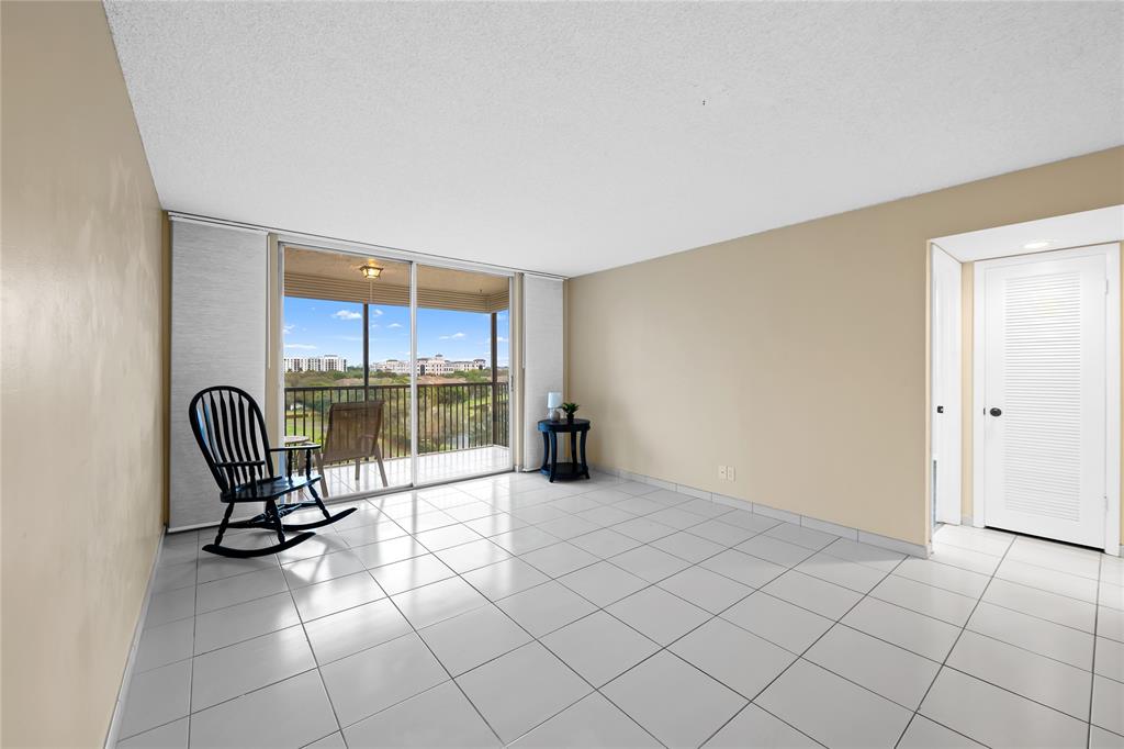 3300 West Rolling Hills Circle, Unit 610 Davie, FL 33328 - Photo 3 of 22 a view of a livingroom with furniture and a window