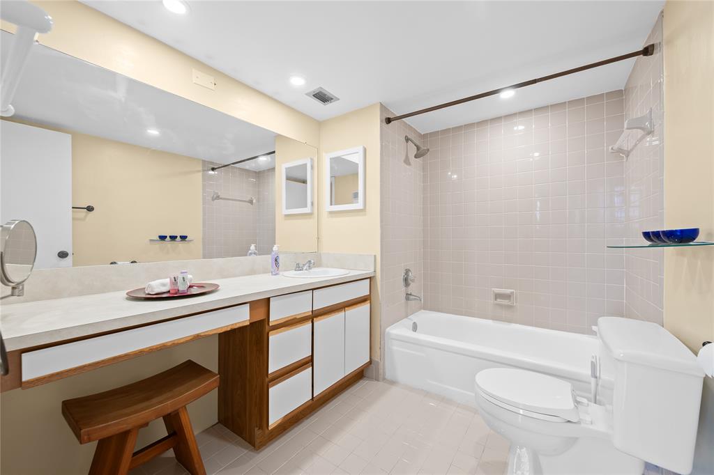 3300 West Rolling Hills Circle, Unit 610 Davie, FL 33328 - Photo 7 of 22 a bathroom with a granite countertop sink mirror toilet and bathtub