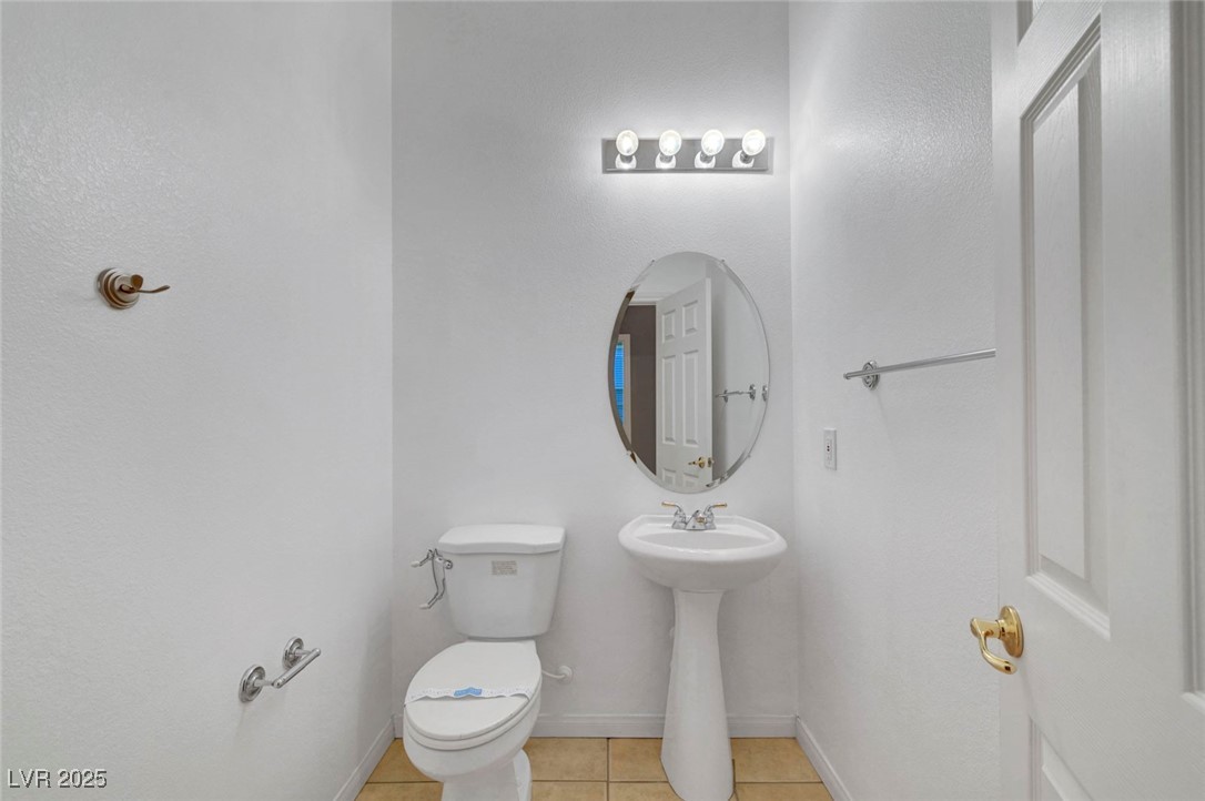 9417 Wisdom Valley Avenue Las Vegas, NV 89149 - Photo 25 of 67 Bathroom featuring tile patterned flooring and toilet