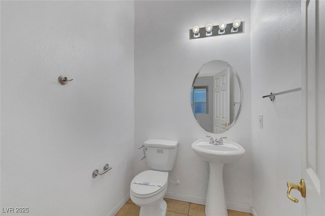 9417 Wisdom Valley Avenue Las Vegas, NV 89149 - Photo 26 of 67 Bathroom with tile patterned floors and toilet