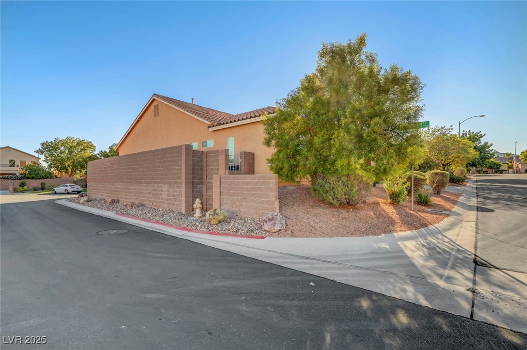 9417 Wisdom Valley Avenue Las Vegas, NV 89149 - Photo 3 of 67 View of side of property with stucco siding and brick siding