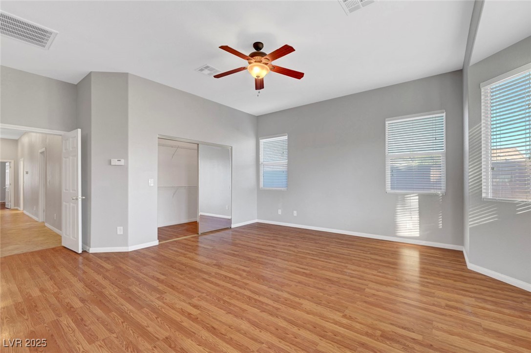 9417 Wisdom Valley Avenue Las Vegas, NV 89149 - Photo 32 of 67 Unfurnished bedroom featuring a closet, light wood-type flooring, and ceiling fan