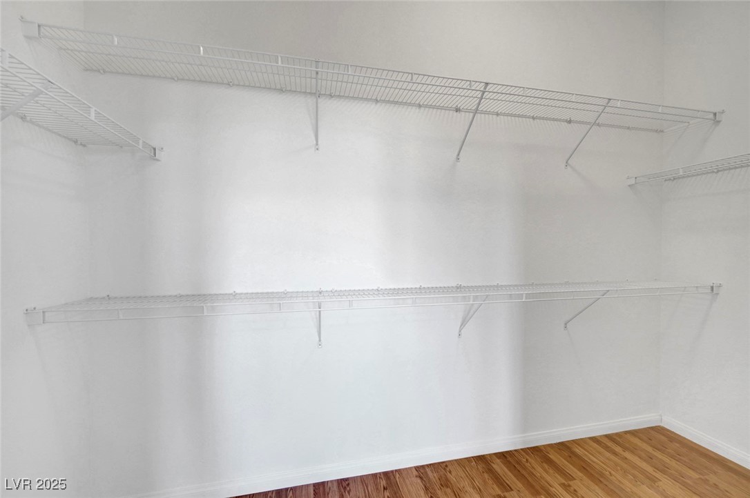 9417 Wisdom Valley Avenue Las Vegas, NV 89149 - Photo 40 of 67 Spacious closet with wood finished floors