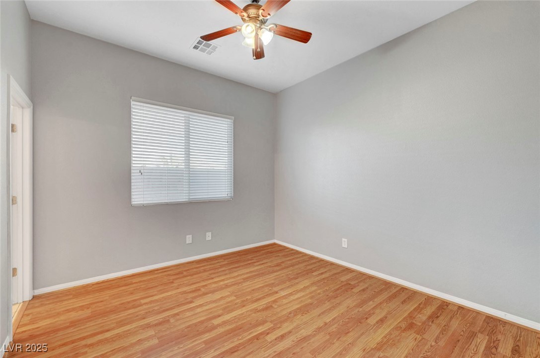 9417 Wisdom Valley Avenue Las Vegas, NV 89149 - Photo 42 of 67 Unfurnished room with wood finished floors and a ceiling fan