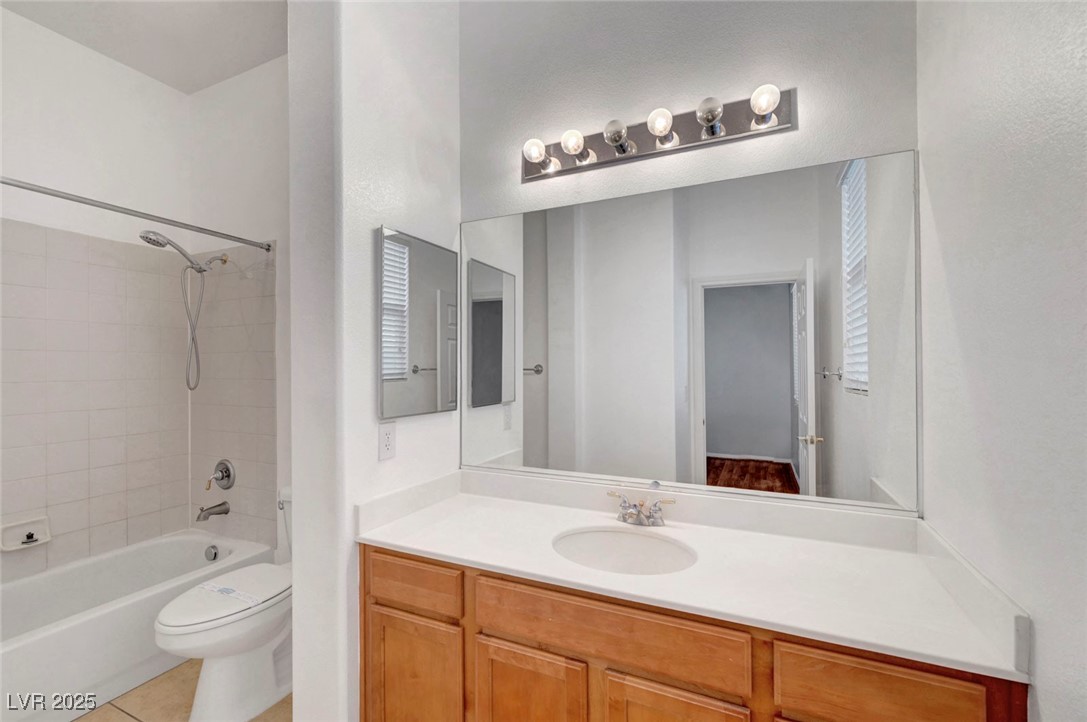 9417 Wisdom Valley Avenue Las Vegas, NV 89149 - Photo 44 of 67 Full bath with shower / washtub combination, vanity, and light tile patterned floors
