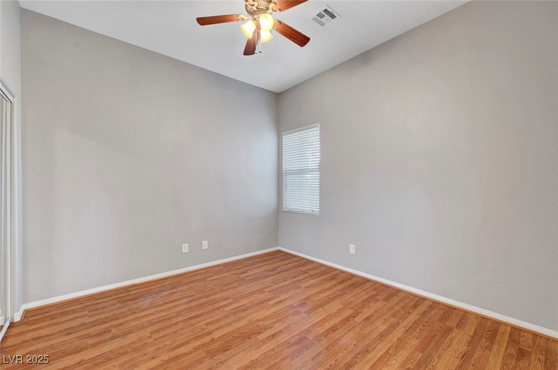 9417 Wisdom Valley Avenue Las Vegas, NV 89149 - Photo 46 of 67 Spare room with wood finished floors and a ceiling fan