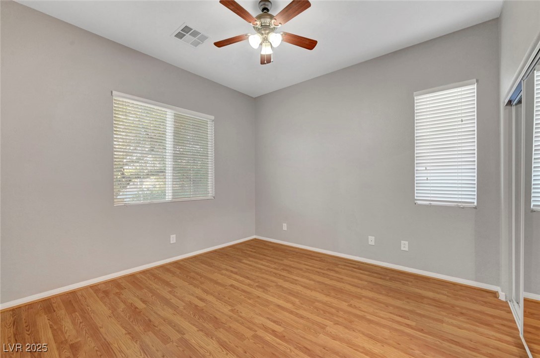 9417 Wisdom Valley Avenue Las Vegas, NV 89149 - Photo 51 of 67 Spare room with light wood-type flooring and a ceiling fan