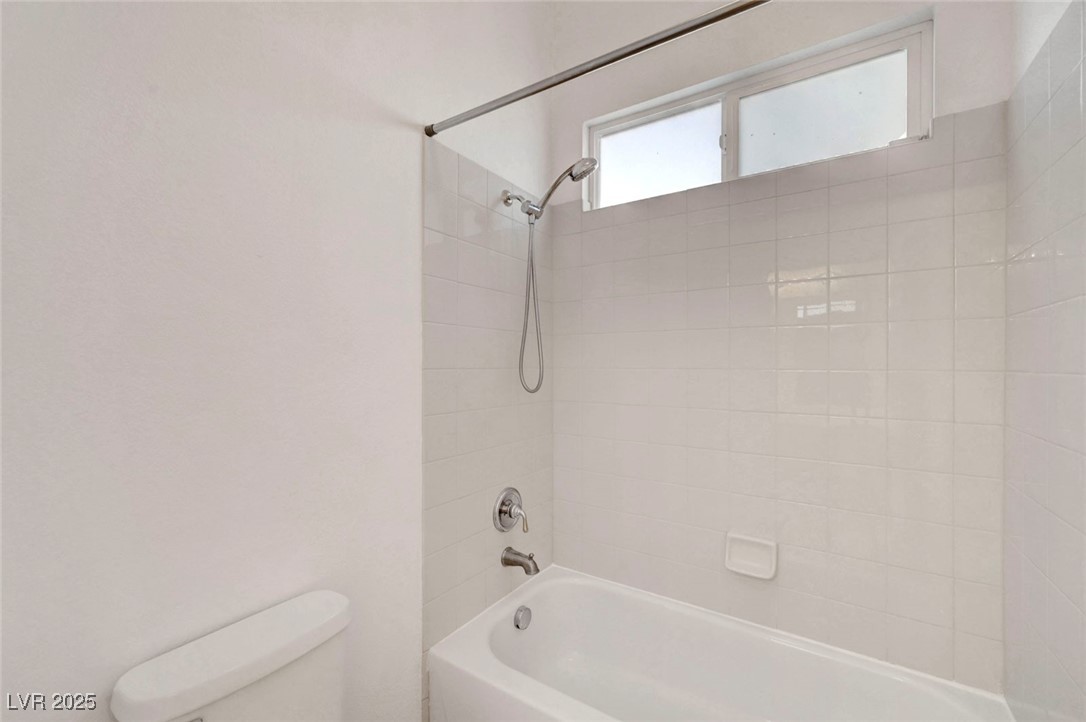 9417 Wisdom Valley Avenue Las Vegas, NV 89149 - Photo 54 of 67 Bathroom featuring bathing tub / shower combination and toilet