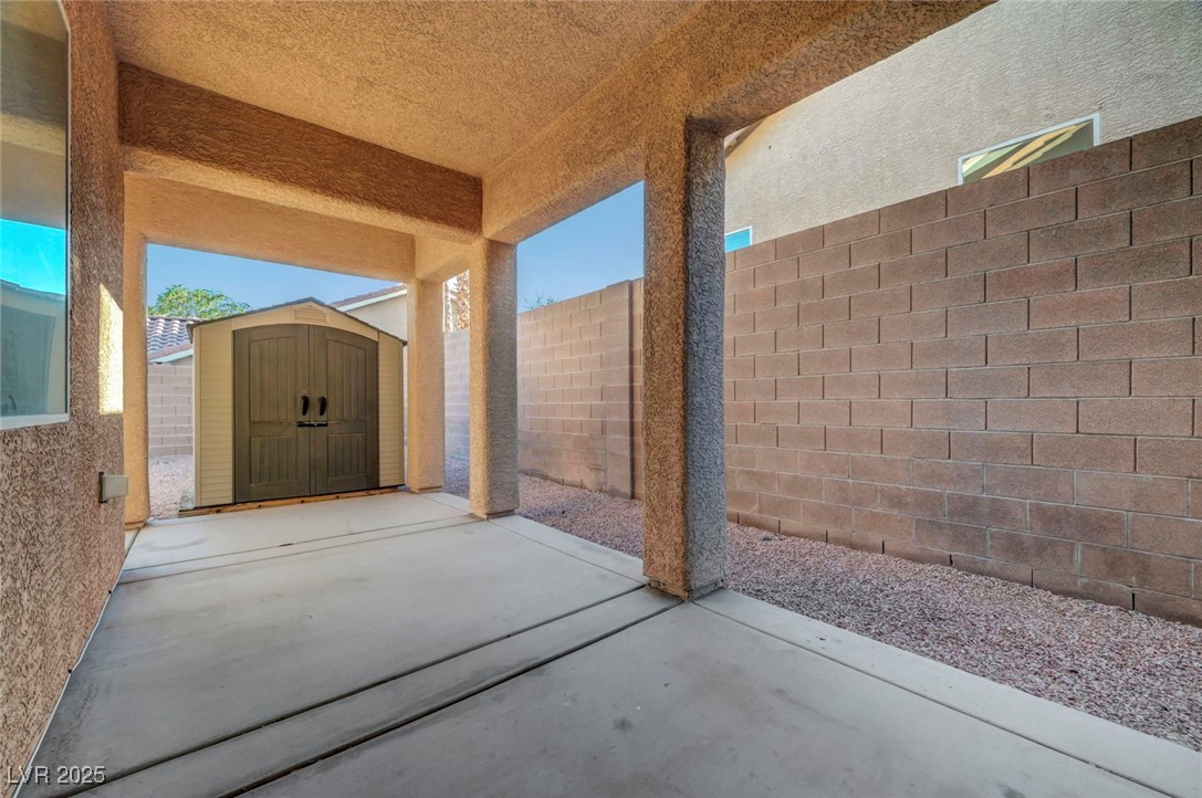 9417 Wisdom Valley Avenue Las Vegas, NV 89149 - Photo 57 of 67 View of patio / terrace with a storage unit
