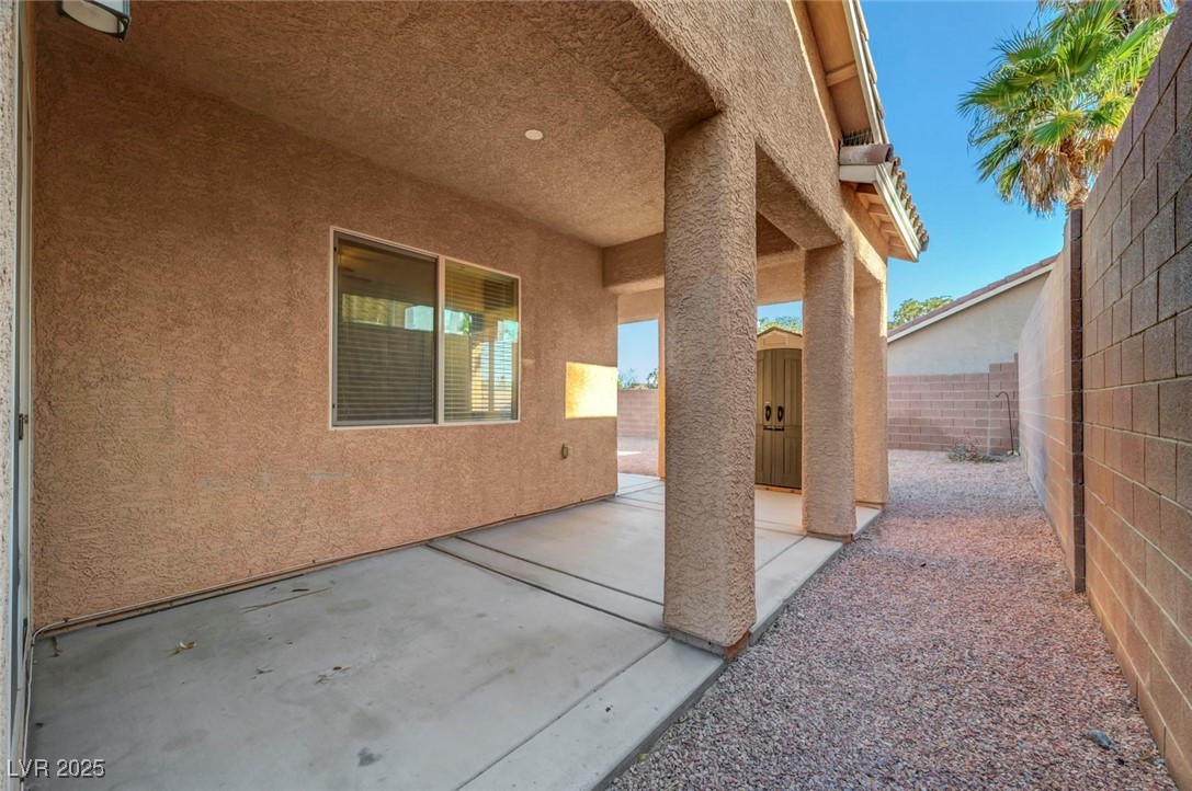 9417 Wisdom Valley Avenue Las Vegas, NV 89149 - Photo 58 of 67 Fenced backyard with a patio area