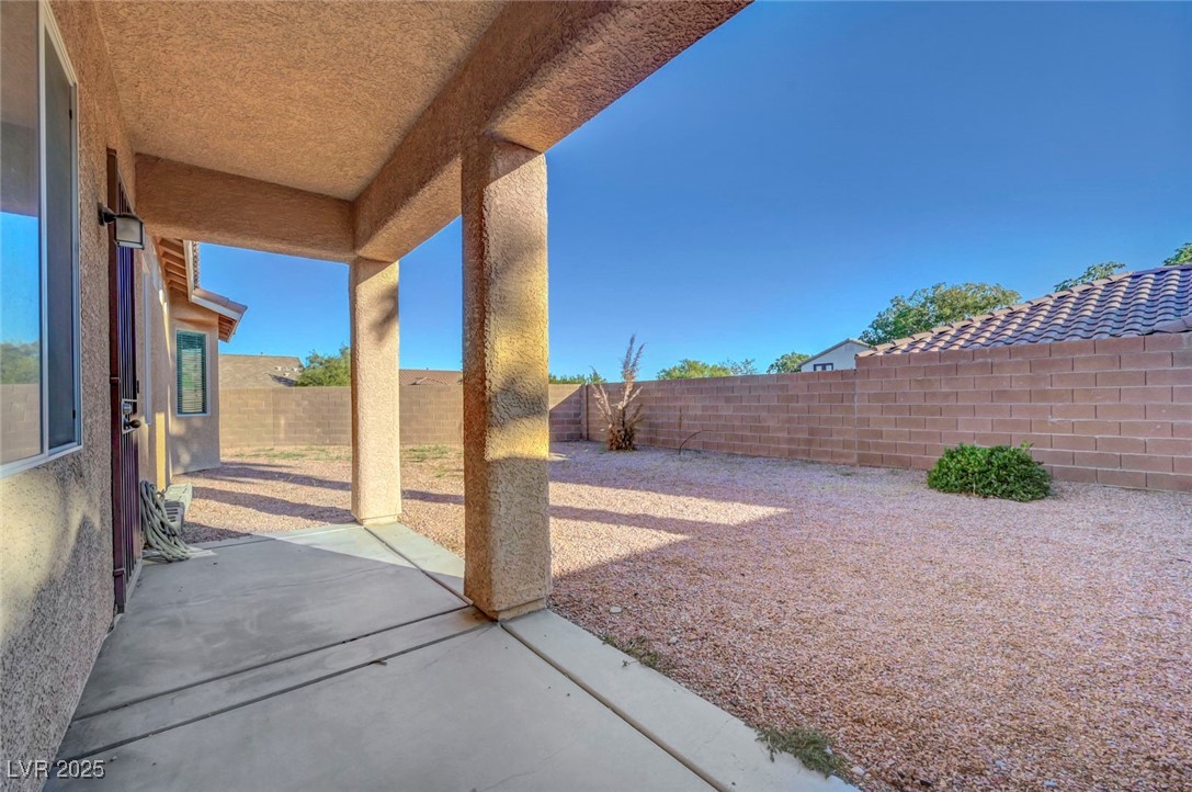 9417 Wisdom Valley Avenue Las Vegas, NV 89149 - Photo 62 of 67 Fenced backyard with a patio area