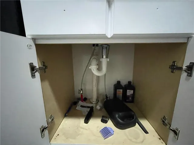 a room with a mirror and a fan