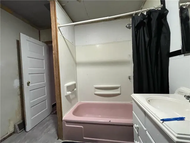 a bathroom with a sink and a shower