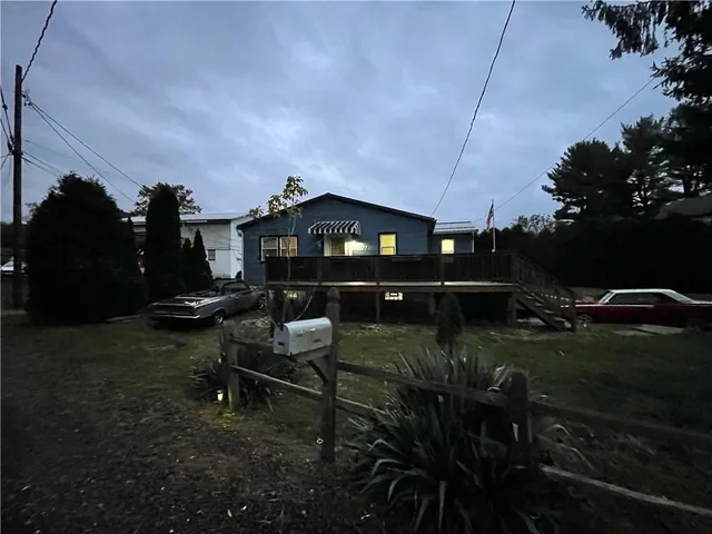 a backyard of a house with table and chairs