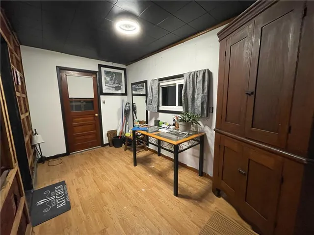 a view of a livingroom with furniture and a window